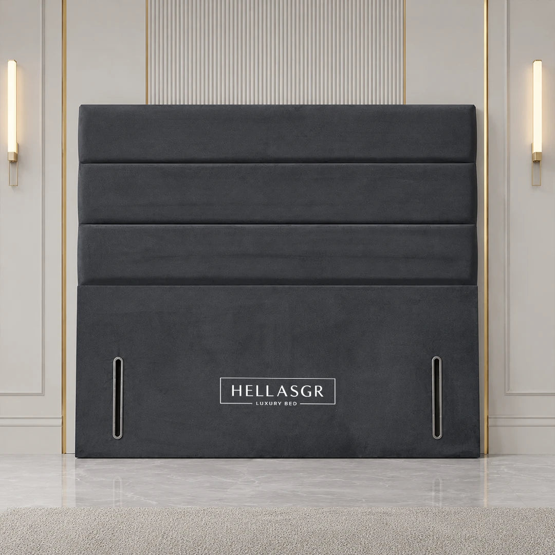 Grey upholstered bed headboard with vertical channel tufting