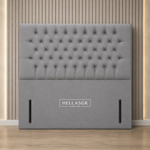A light gray tufted upholstered headboard