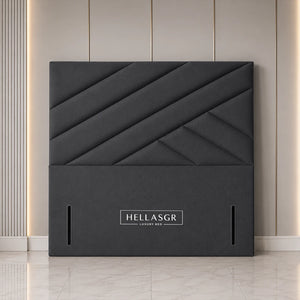 A dark gray upholstered headboard with a geometric diamond quilted pattern 