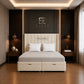 A cream upholstered bed with a tall segmented headboard and storage base