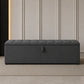 Dark grey upholstered ottoman storage box with lift-up lid