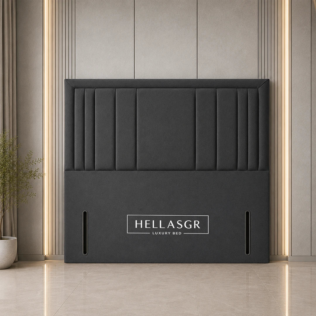 A dark gray upholstered headboard with vertical channel