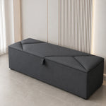 Dark grey upholstered ottoman storage box with lift-up lid