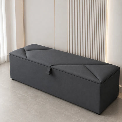 Dark grey upholstered ottoman storage box with lift-up lid