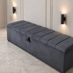 Dark grey upholstered ottoman storage box with lift-up lid