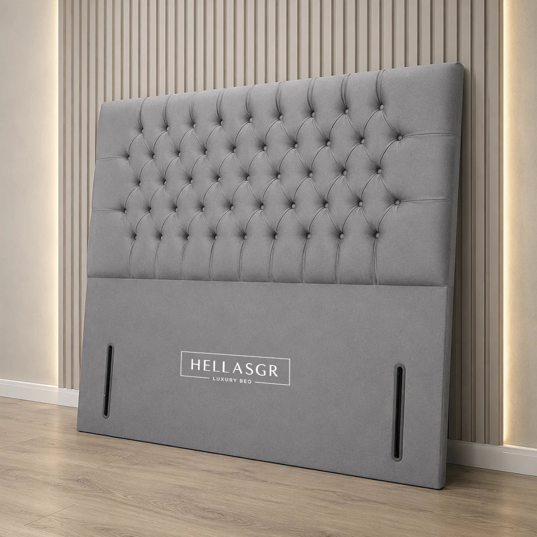 A light gray tufted upholstered headboard