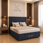 Navy blue upholstered bed frame with a tall headboard and storage base