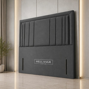 A dark gray upholstered headboard with vertical channel