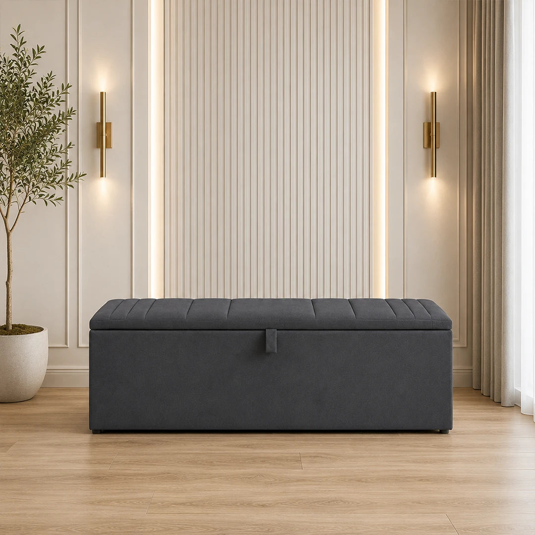 Dark grey upholstered ottoman storage box with lift-up lid