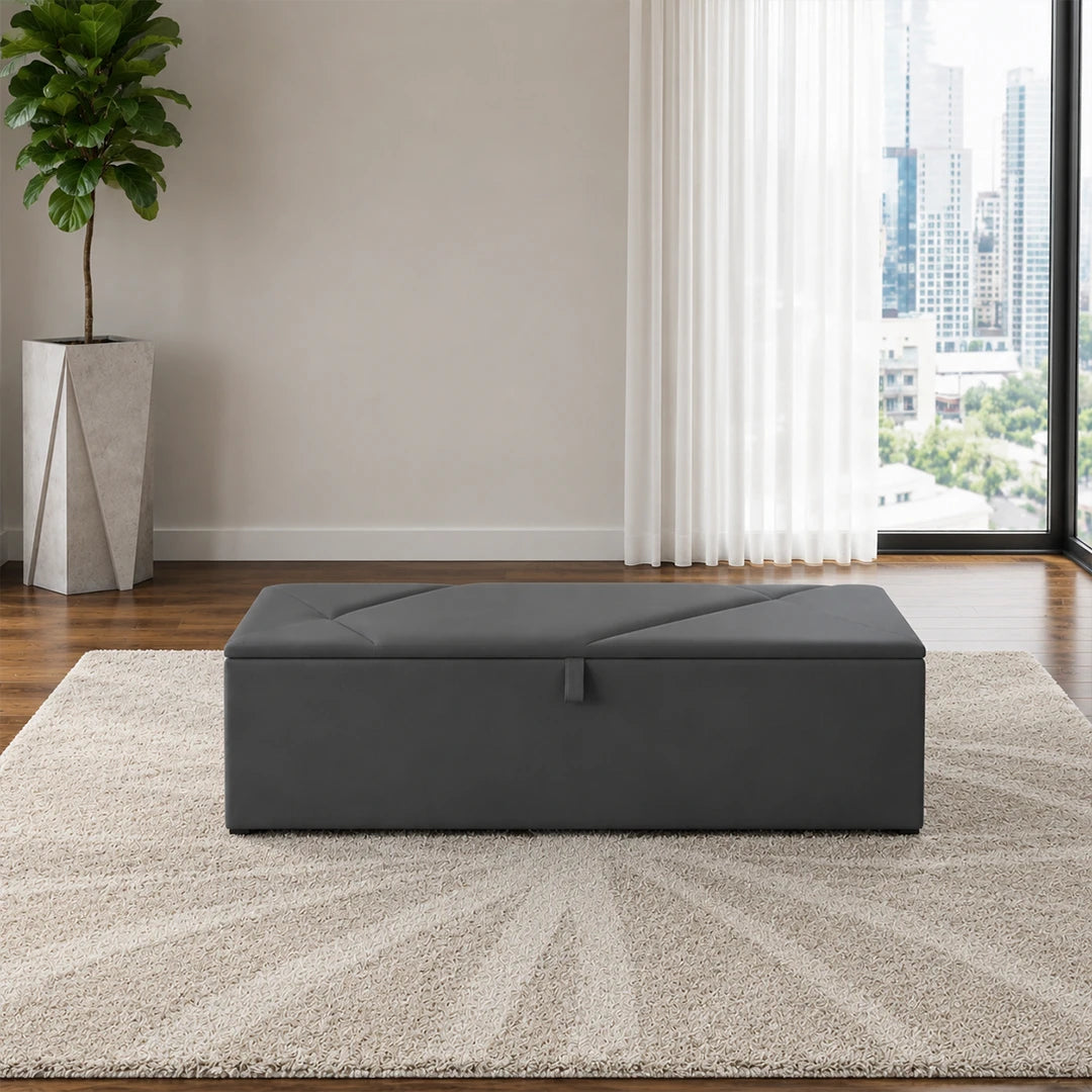 Dark grey upholstered ottoman storage box with lift-up lid