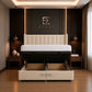 A cream upholstered bed with a tall segmented headboard and storage base