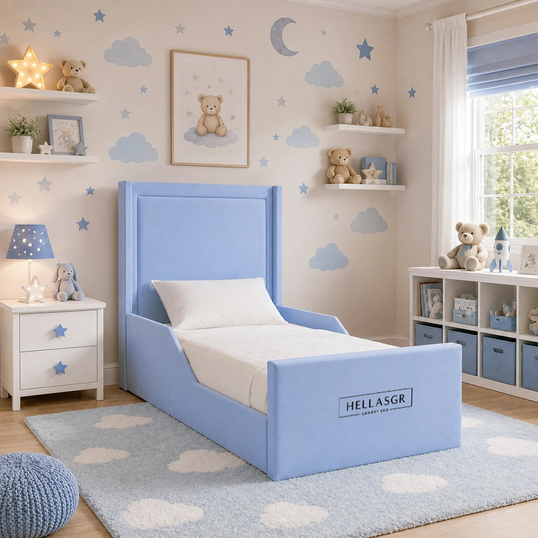 A blue children's bed with a high upholstered headboard and footboard
