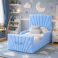 A light blue upholstered children's bed with a tall pleated headboard and matching footboard