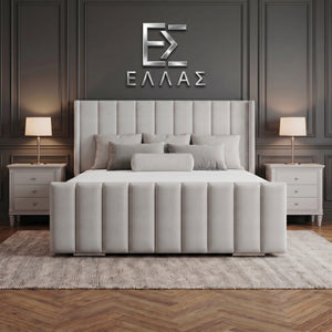 Gray upholstered Newyork Wingback bed in a bedroom setting with 'ELLEA' logo on the wall.