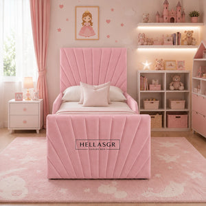 A pink children's single bed with a pleated headboard and footboard