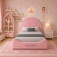 A pink children's bed frame with a curved headboard and footboard