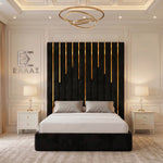 Modern bedroom with a black headboard and white bedding, Piano Gold Trim bed featuring a decorative ceiling light and nightstands.