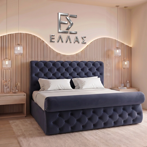 Modern bedroom with a tufted blue Prisma Royal bed and decorative wall letters.