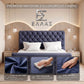 Bedroom with a blue tufted headboard and plush velvet fabric, featuring a Prisma Royal bed