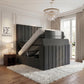 Gray adjustable Verto TV  bed in a stylish bedroom with a chandelier and side table.