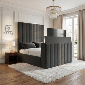 Modern bedroom with a large gray upholstered Verto TV  bed, nightstand, and chandelier.