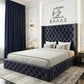 Modern bedroom with a black tufted Midnight Columbus bed and decorative wall art.
